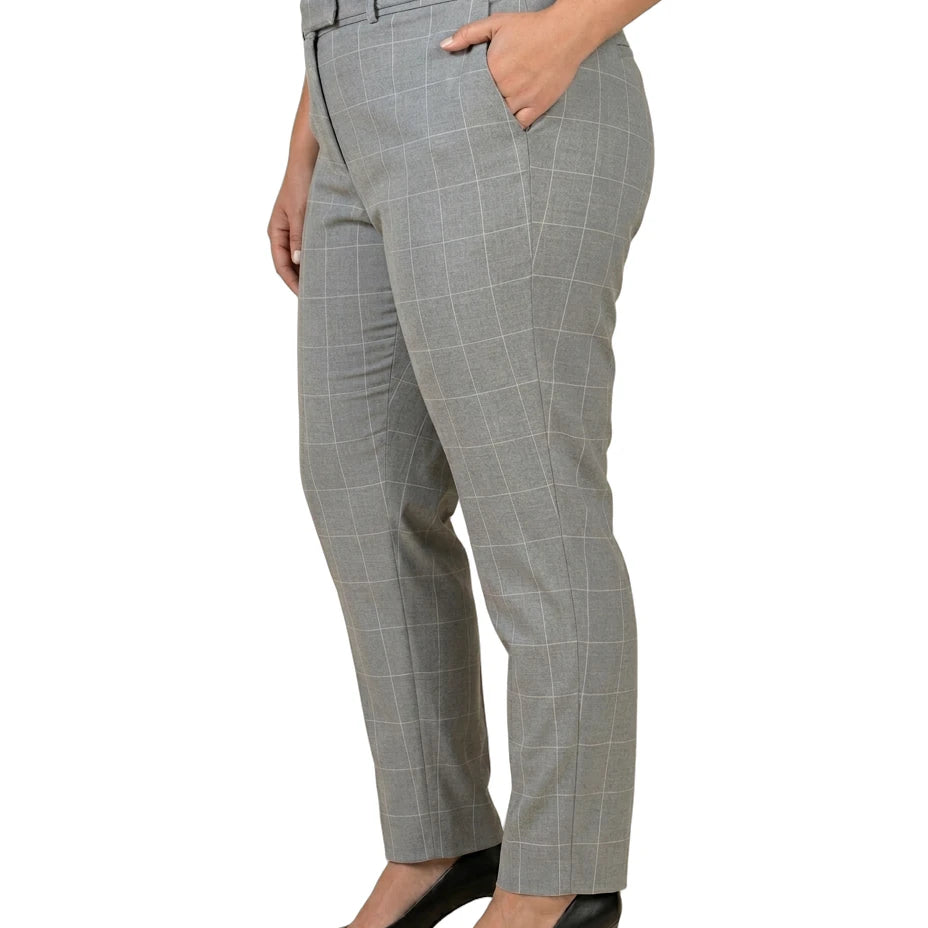 Calvin Klein gray checkered pants worn by a person on a white background