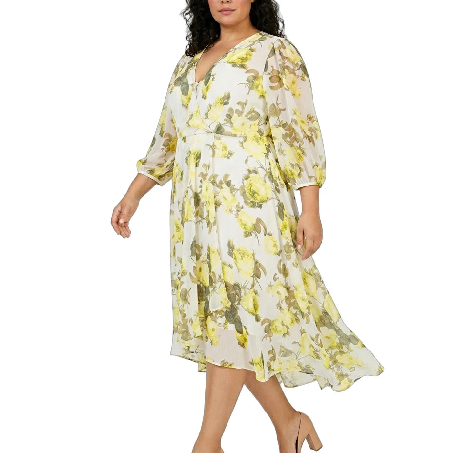 Woman wearing a Calvin Klein floral dress on a white background