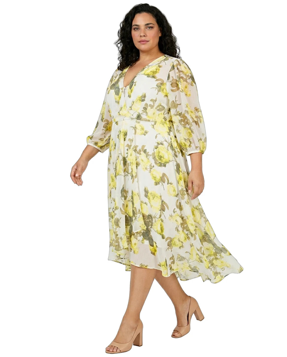 Woman wearing a Calvin Klein floral dress on a white background