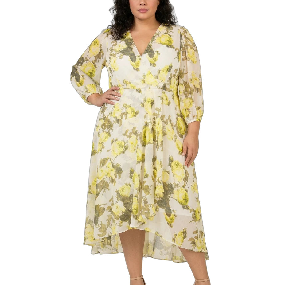 Woman wearing a Calvin Klein floral dress on a white background