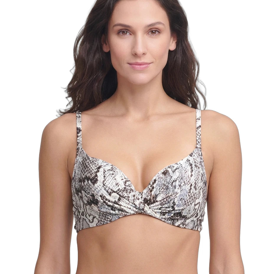Woman wearing a patterned Calin Klein bikini top on a white background