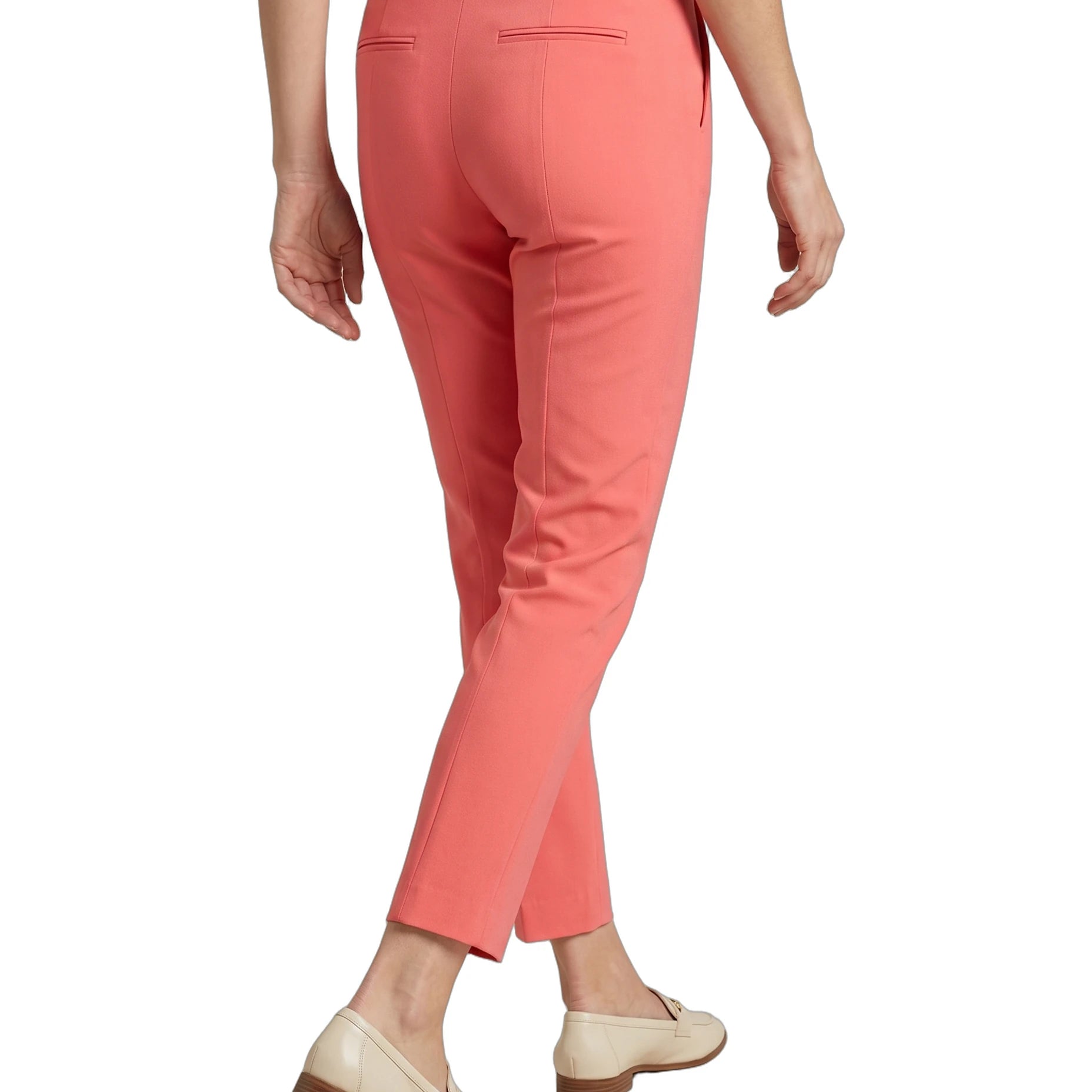 Coral Calvin Klein pants worn by a person on a white background