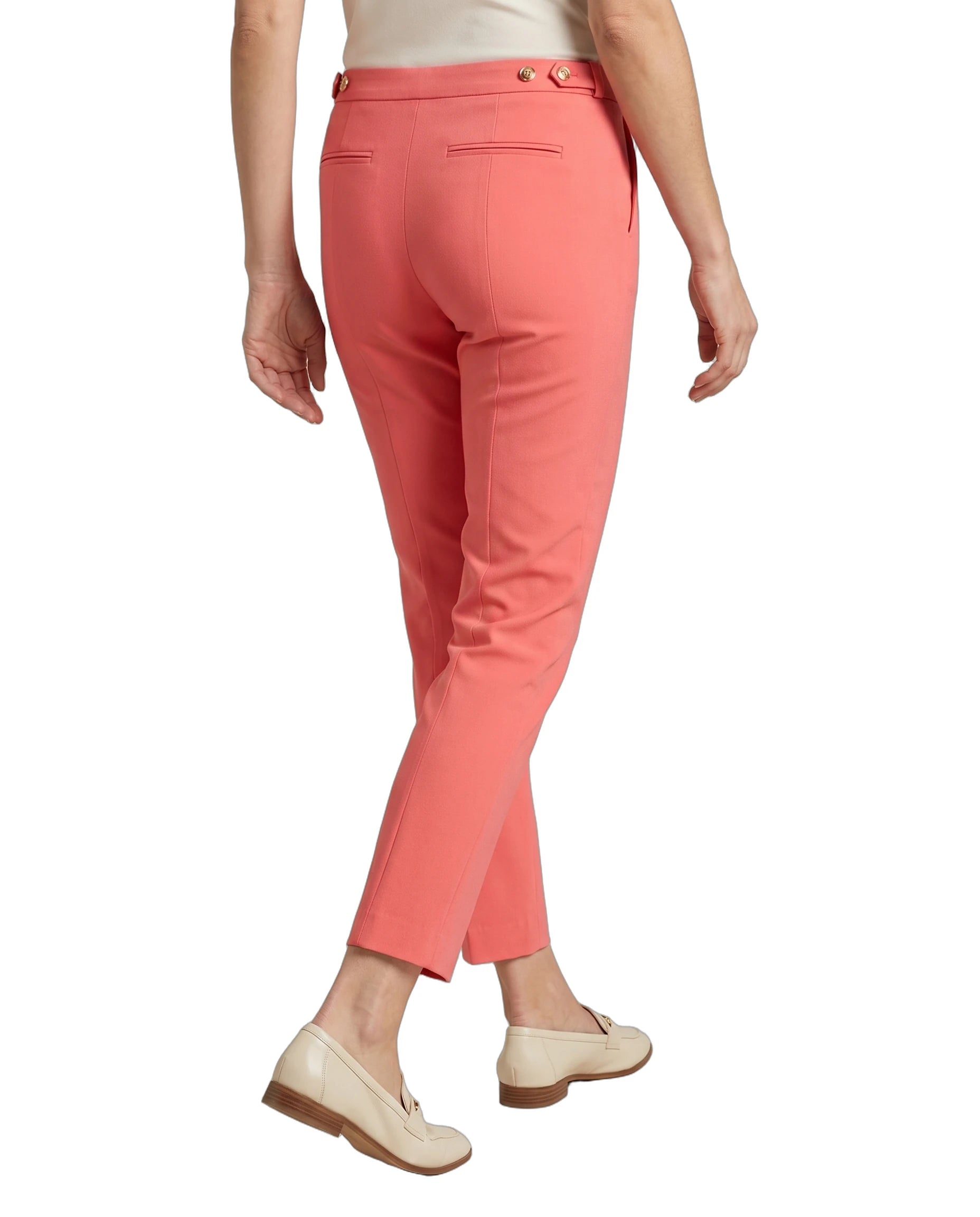 Coral Calvin Klein pants worn by a person on a white background