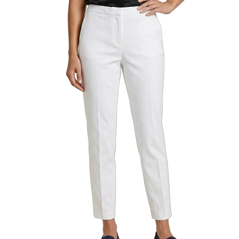 Person wearing white Calvin Klein pants on a white background