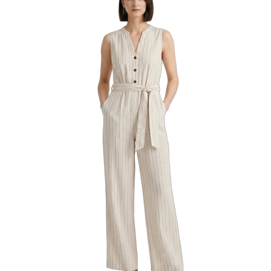 Woman wearing a beige striped Calvin Klein jumpsuit on a white background