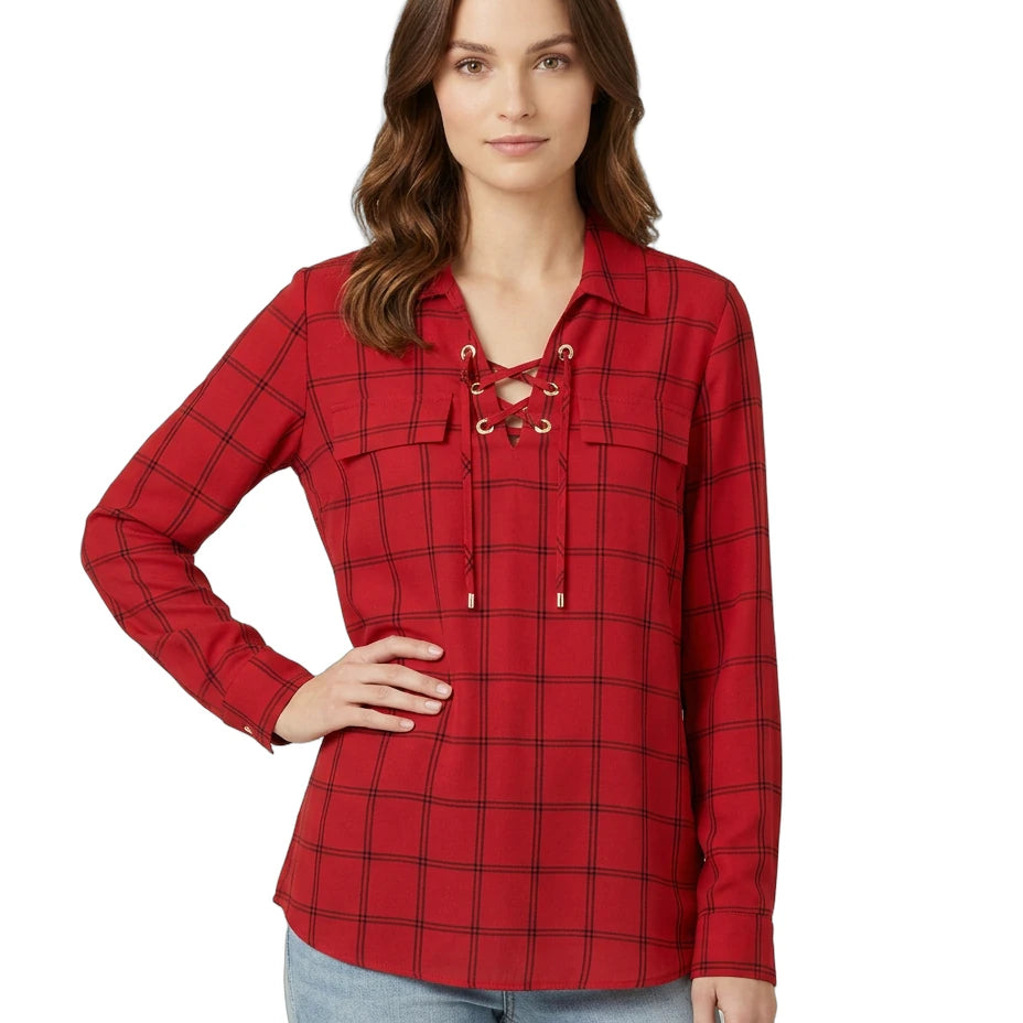Woman wearing a red plaid Calvin Klein shirt with lace-up details on a white background