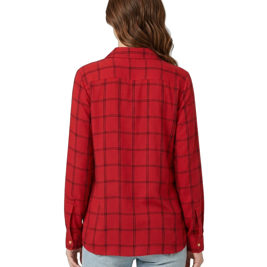 Person wearing a red plaid Calvin Klein shirt on a white background