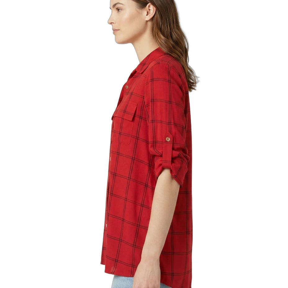 Woman wearing a red plaid Calvin Klein shirt on a white background