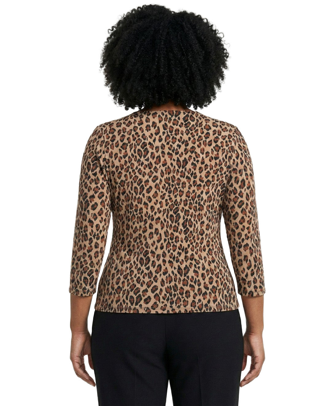 Person wearing a leopard print top with a plain background
