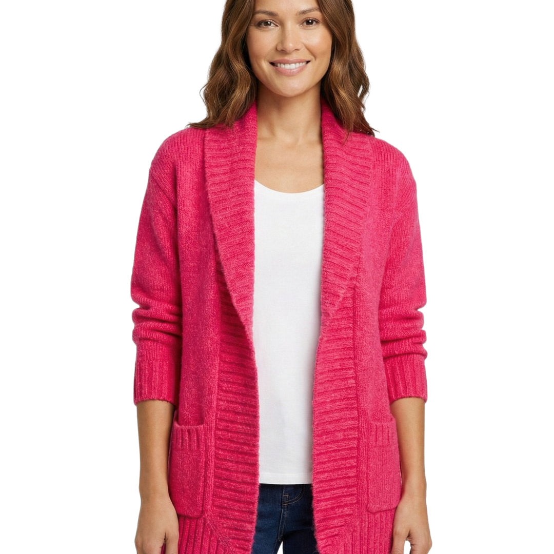 Woman wearing a bright pink cardigan over a white shirt on a white background
