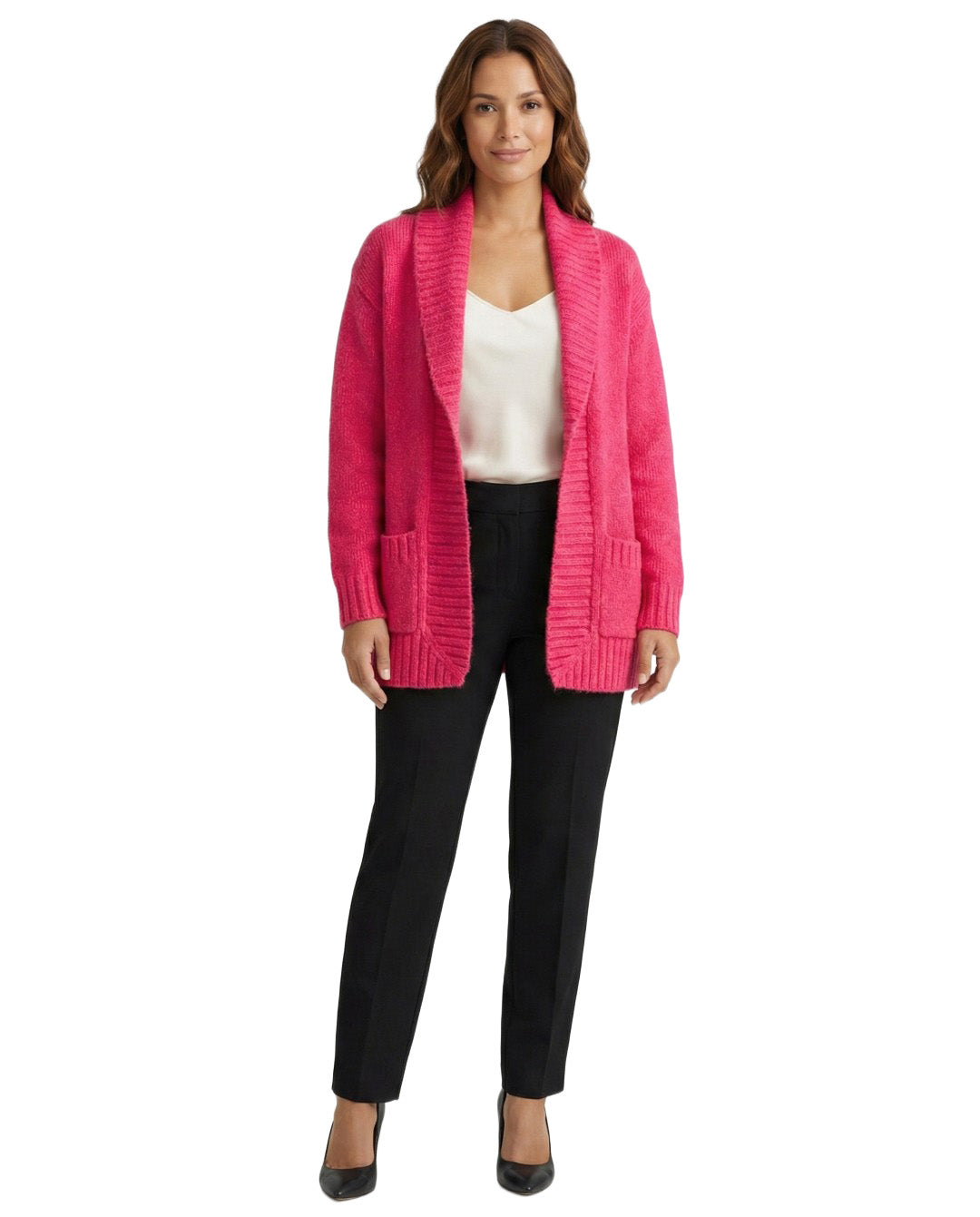 Woman wearing a bright pink cardigan over a white top and black pants on a white background