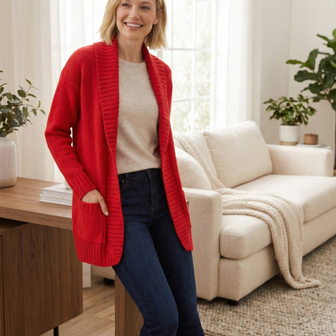 Woman wearing a red cardigan in a living room setting