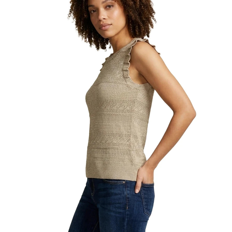 Side profile view of a woman wearing the INC International Concepts sleeveless beige knit top showing the pleated ruffle trim along the shoulder armhole.