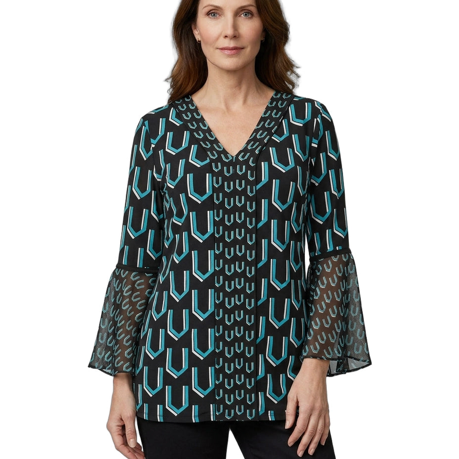 Woman wearing a patterned blouse with bell sleeves on a white background