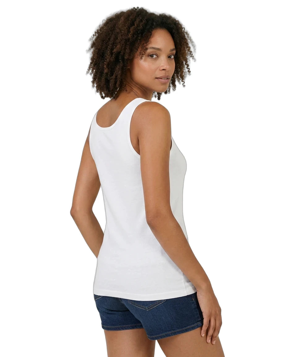 Woman wearing a white tank top and denim shorts on a white background