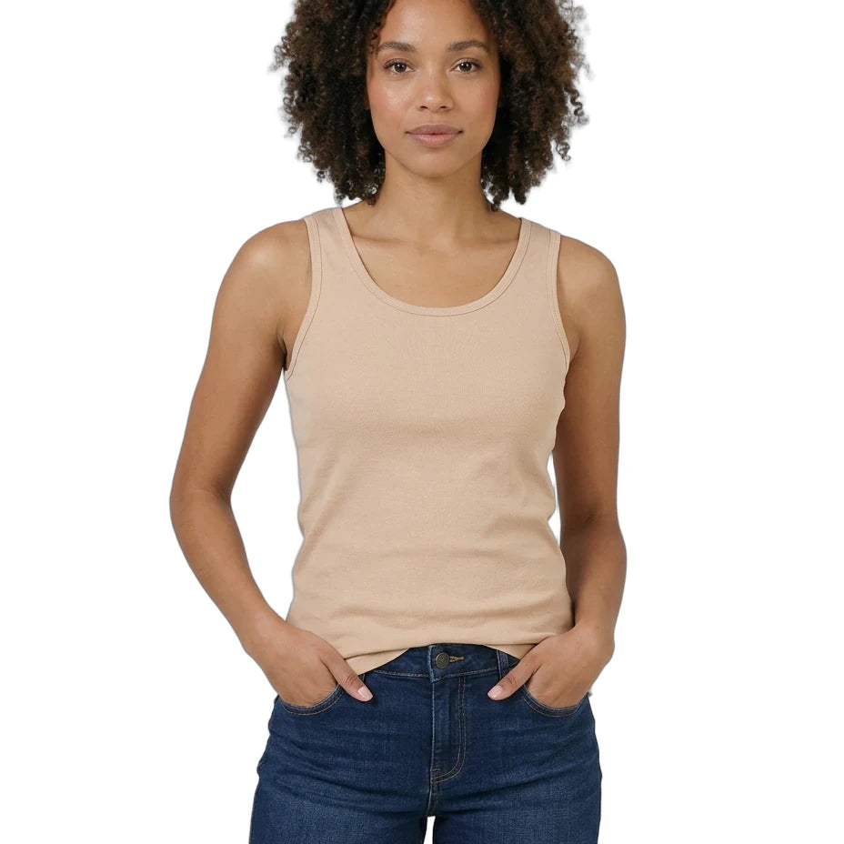 Woman wearing a beige tank top and denim shorts on a white background