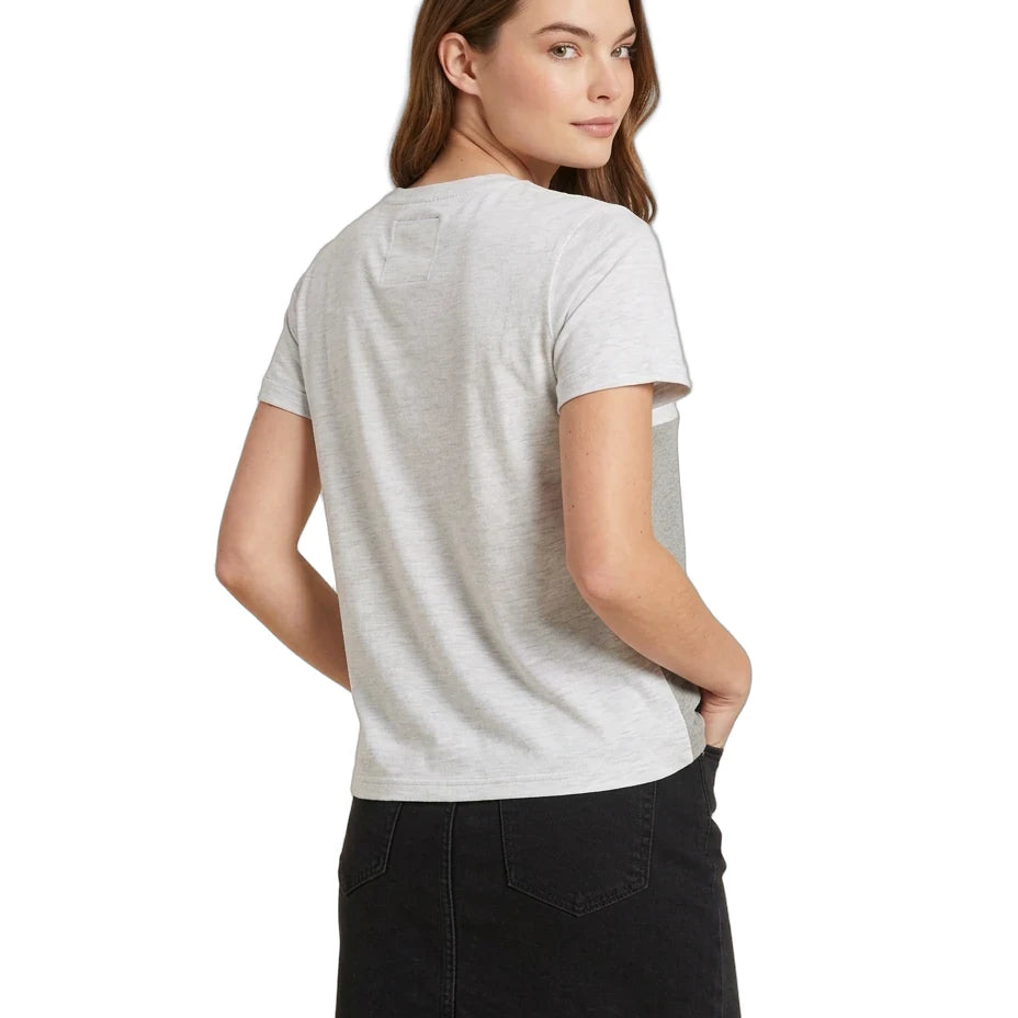 A woman shown from the back wearing a light gray short-sleeve t-shirt and a black denim mini skirt, photographed against a solid white background.