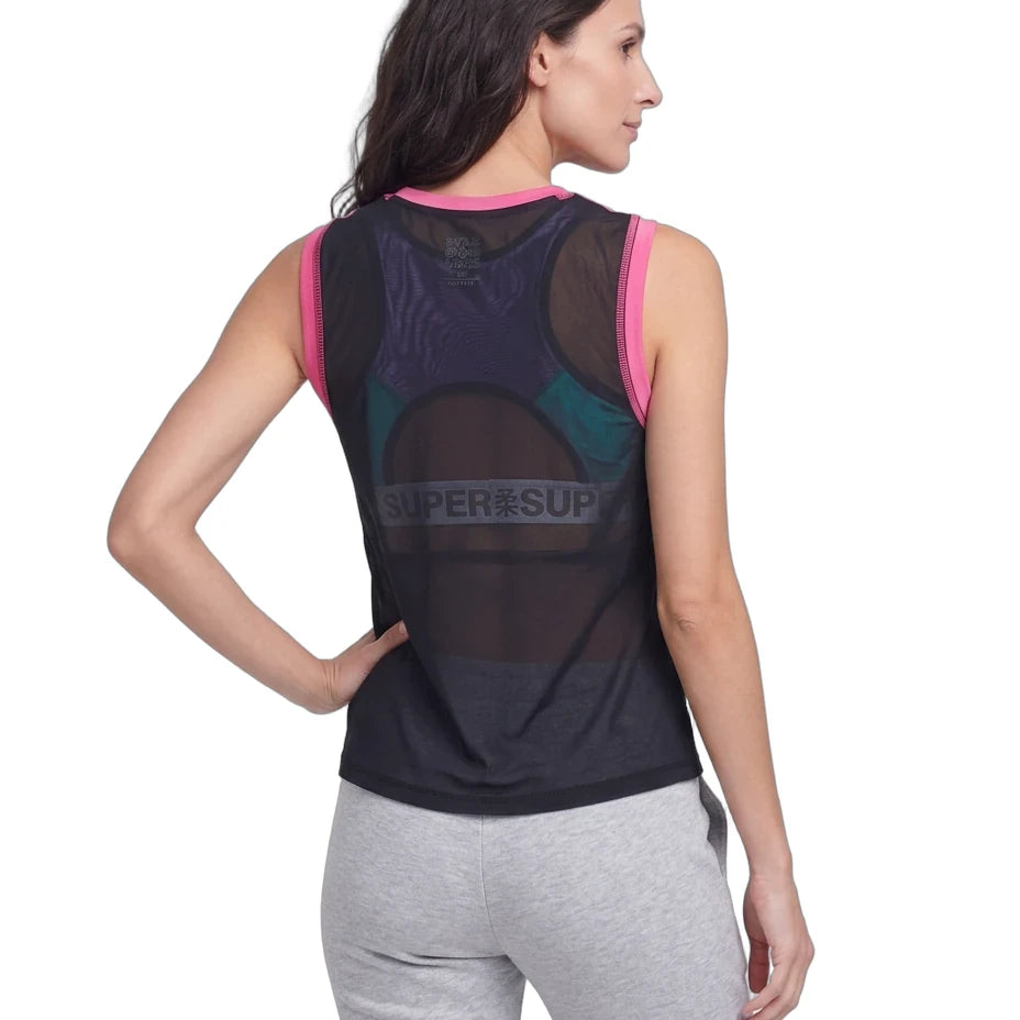 A woman shown from the back wearing a sleeveless athletic top with a sheer mesh back panel and a large SUPER'SUP logo across the center, paired with light gray sweatpants on a white studio background.