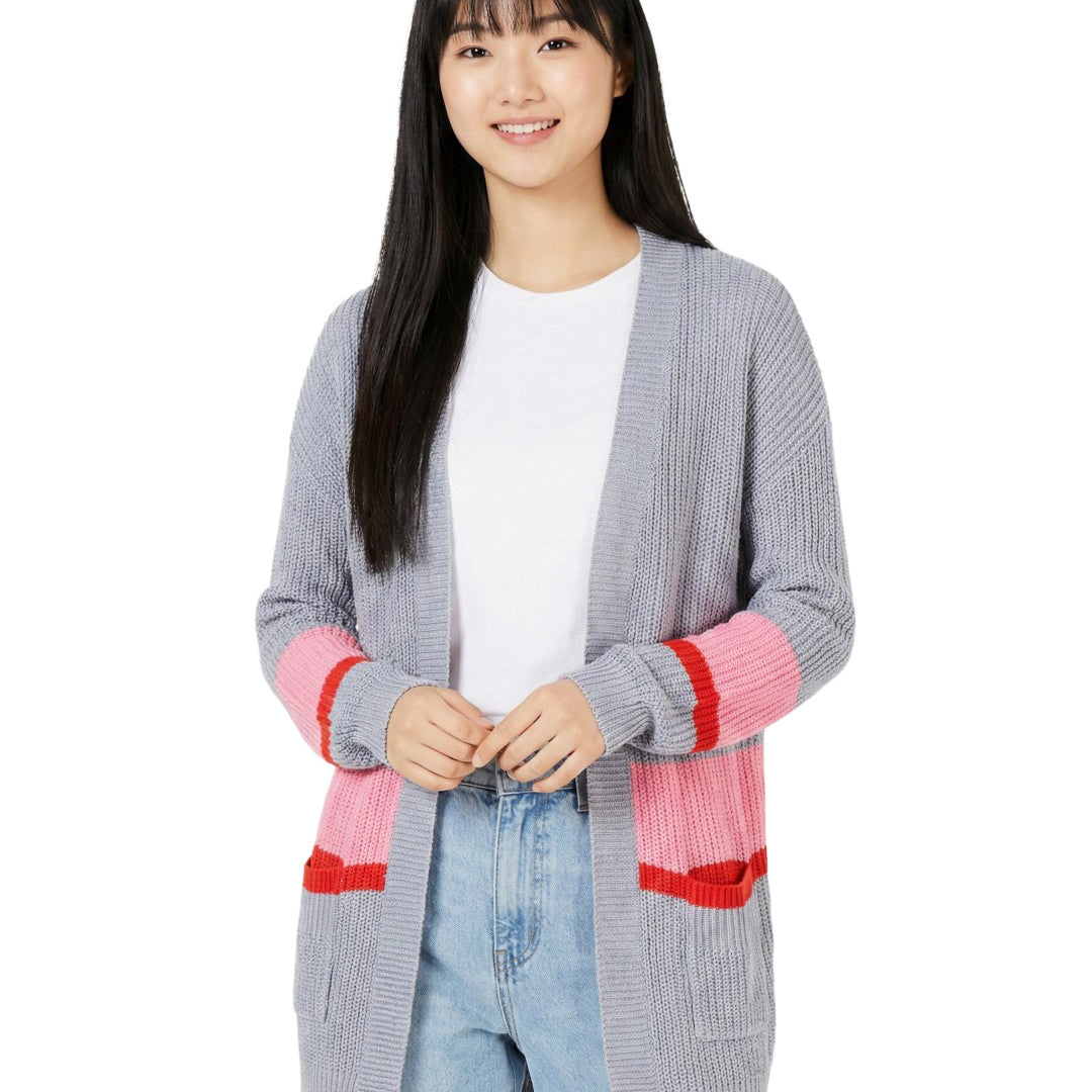 Woman wearing a gray cardigan with pink accents on a white background