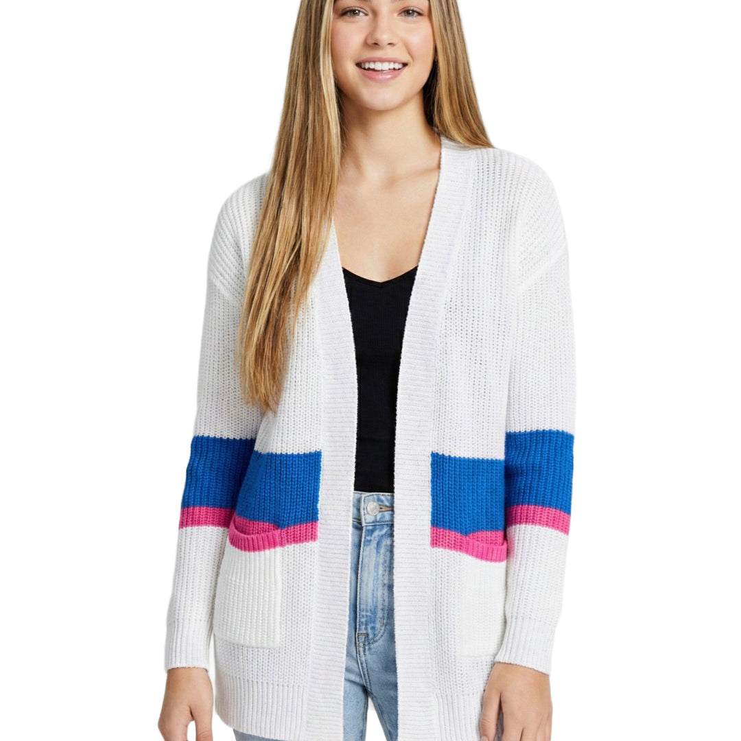Woman wearing a white cardigan with blue and pink accents on a white background