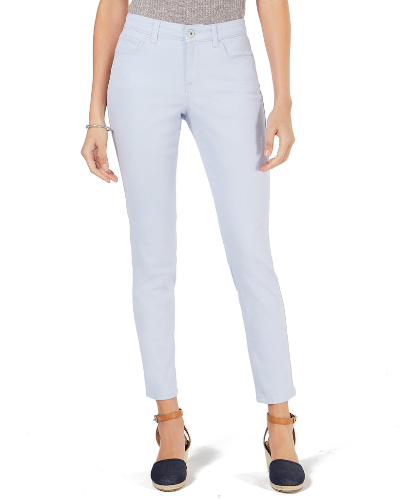 Light blue jeans worn by a person on a white background