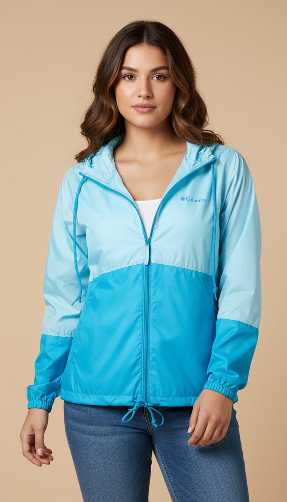 Woman wearing a blue and light blue jacket on a beige background