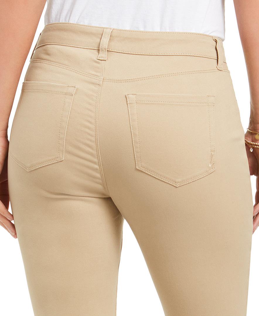 Beige pants with a white background