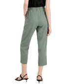 Person wearing green pants on a white background