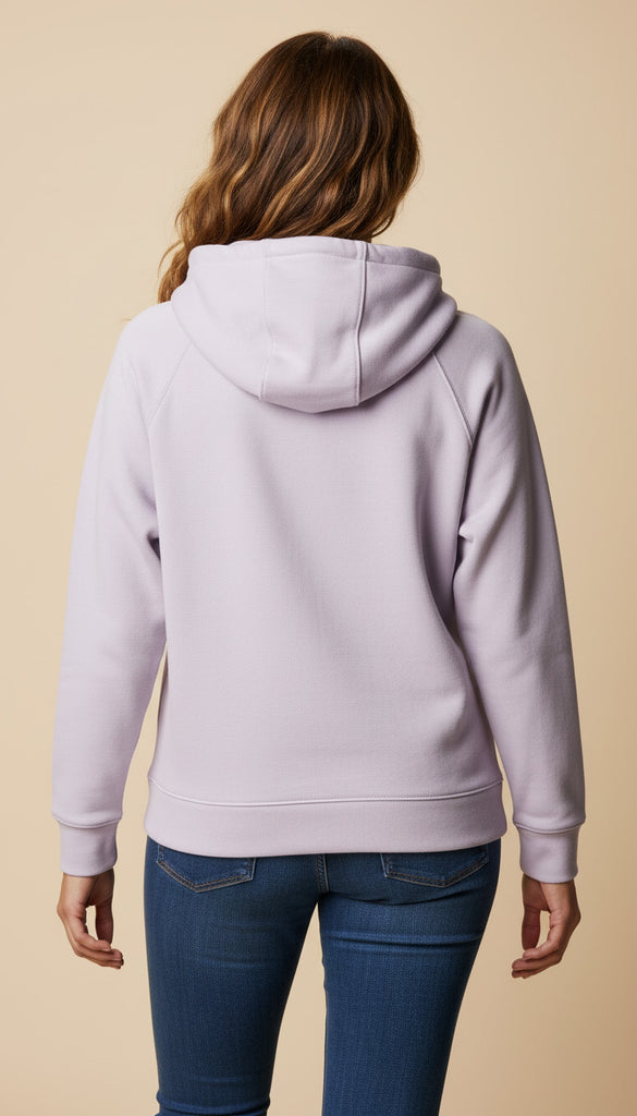 Person wearing a light purple hoodie from behind on a beige background