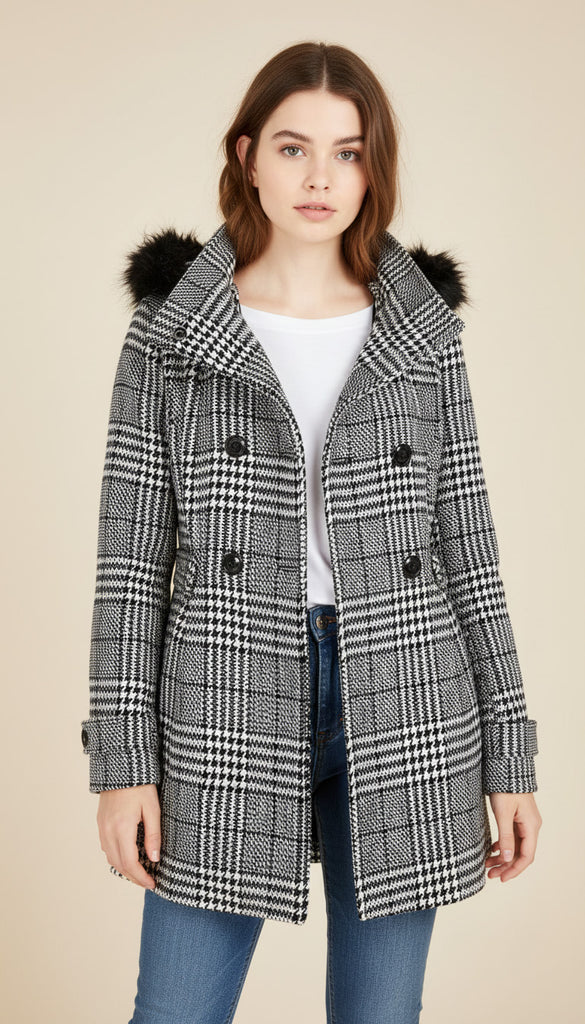 Teen wearing a checkered coat with fur-lined hood on a beige background