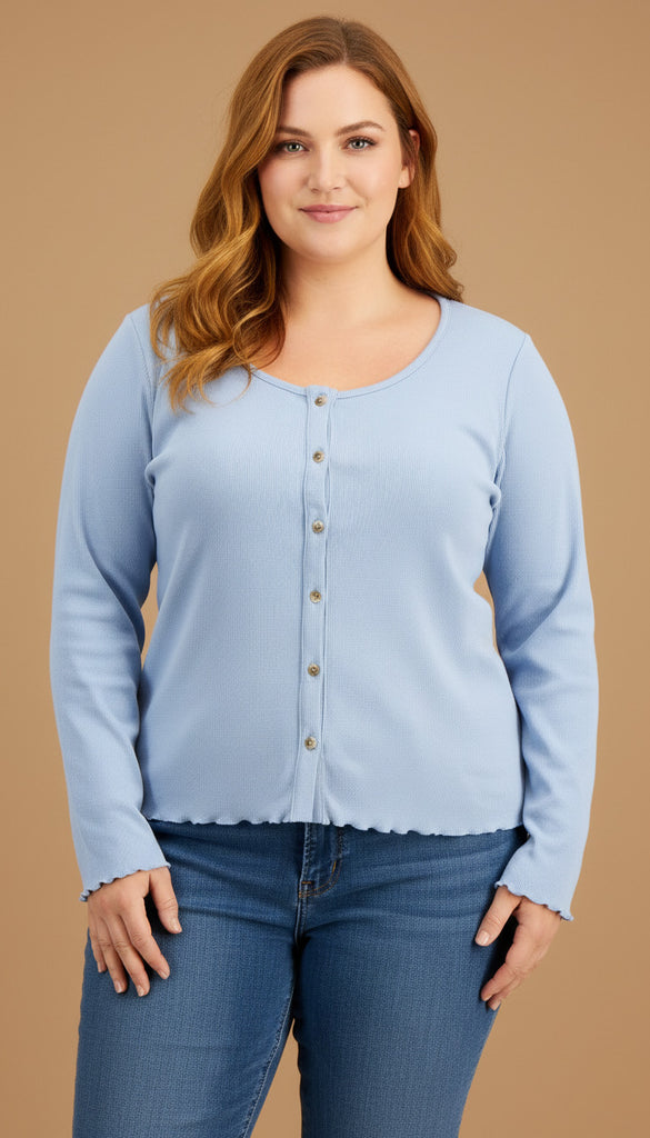 Woman wearing a light blue long-sleeve shirt and jeans on a beige background
