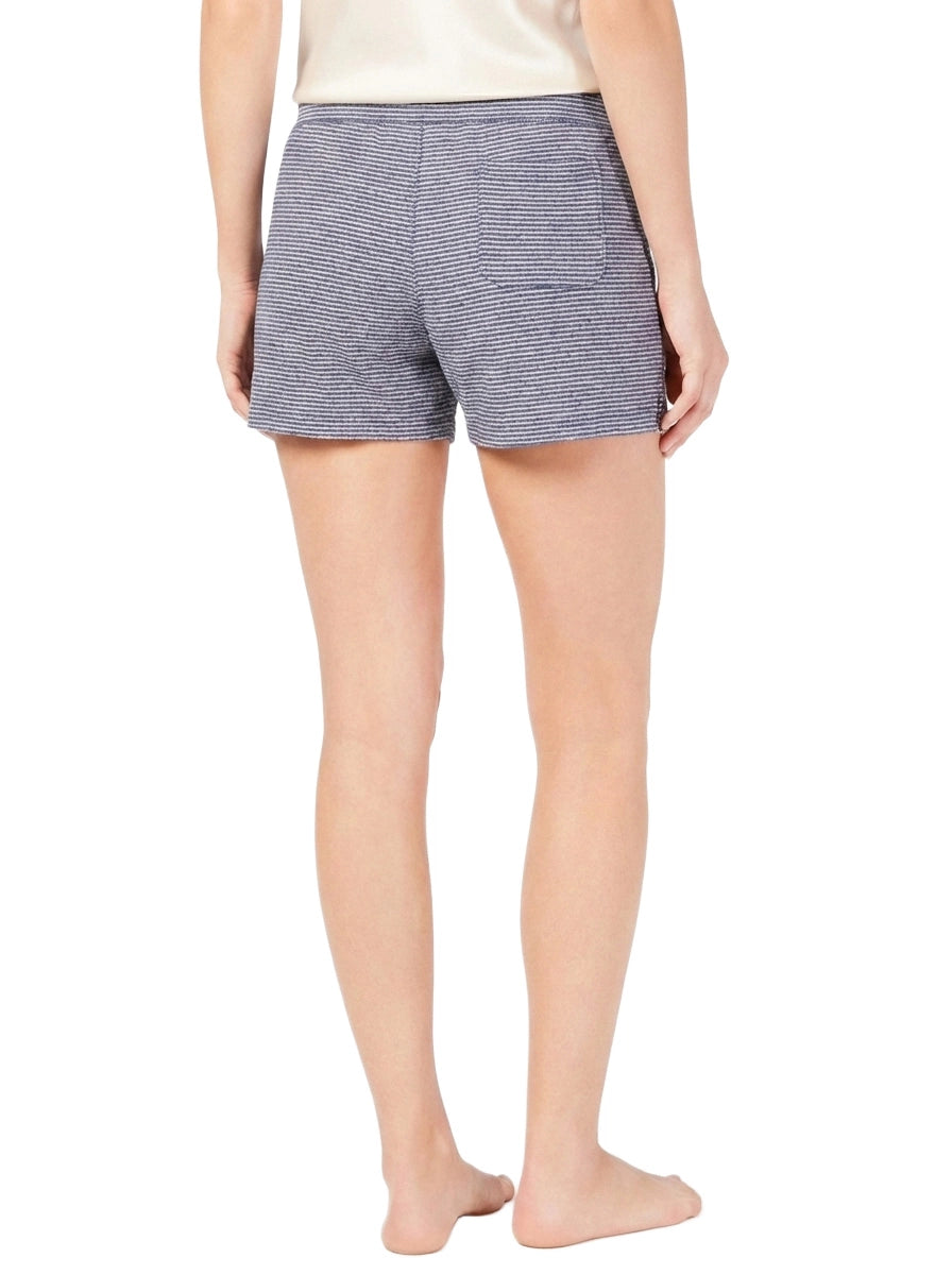 Person wearing blue striped shorts on a white background