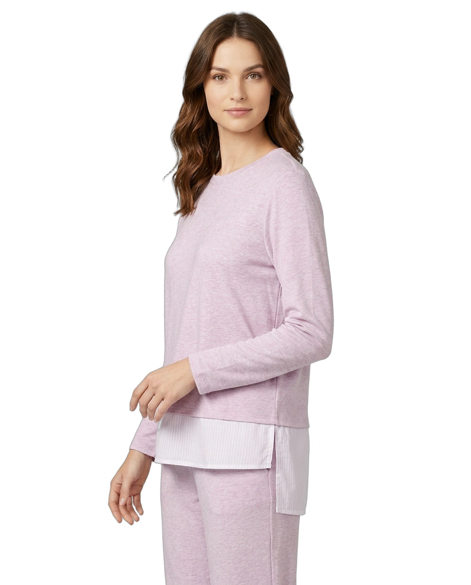 Woman wearing a light purple pajama set on a white background