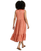 Woman wearing a coral dress on a white background