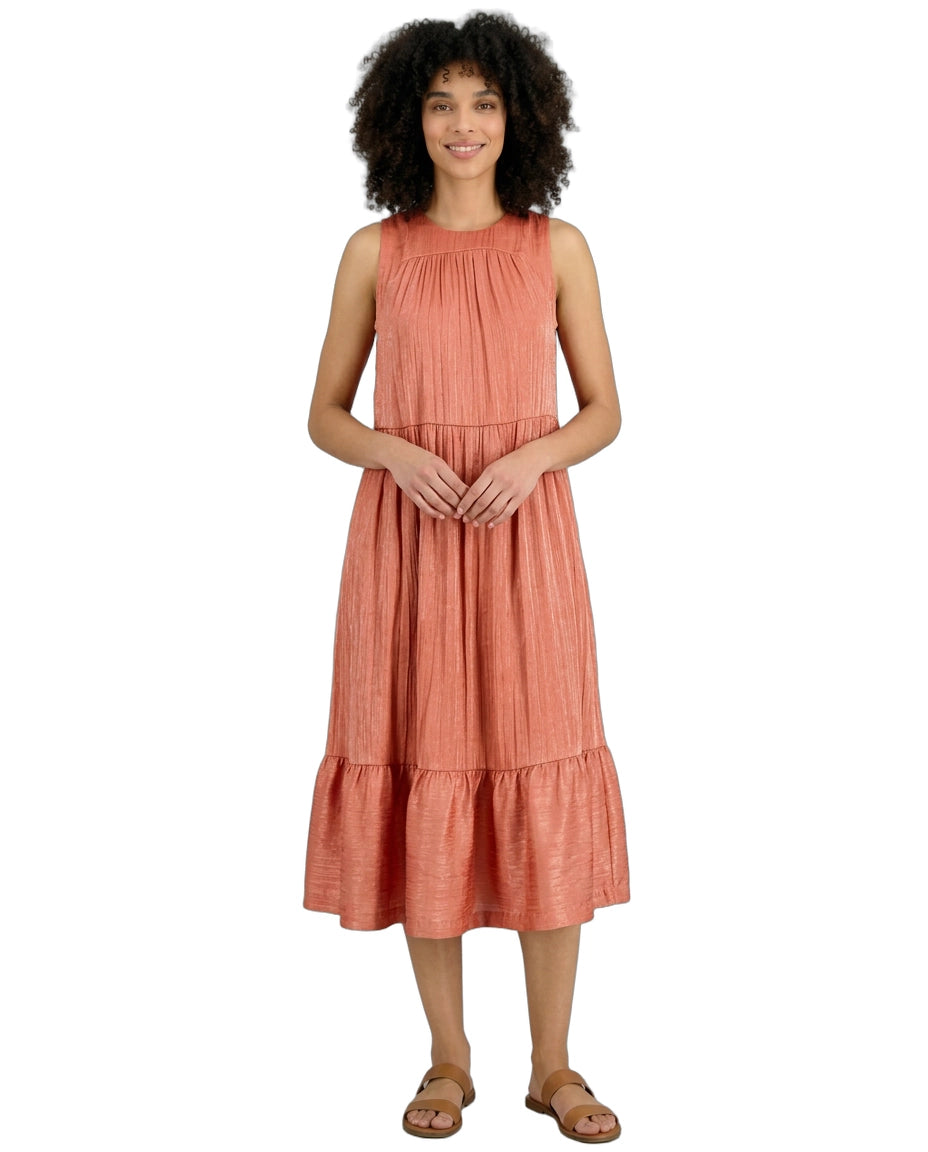Woman wearing a coral dress on a white background
