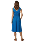 Woman wearing a blue dress on a white background