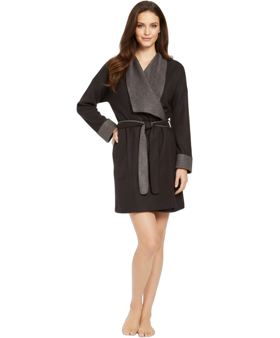 Woman wearing a black and gray robe on a white background