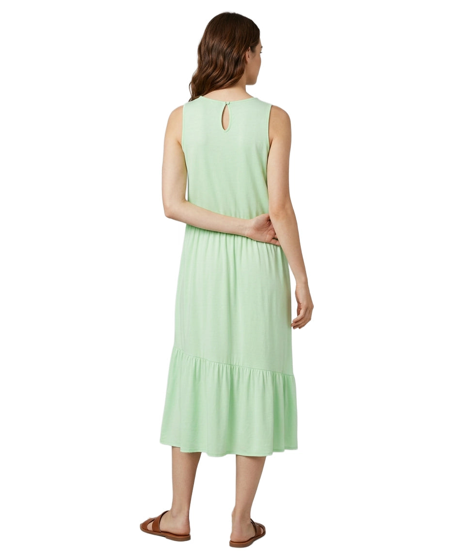 Woman wearing a light green dress on a white background