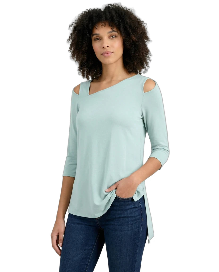 Woman wearing a light blue top with cold shoulder design on a white background