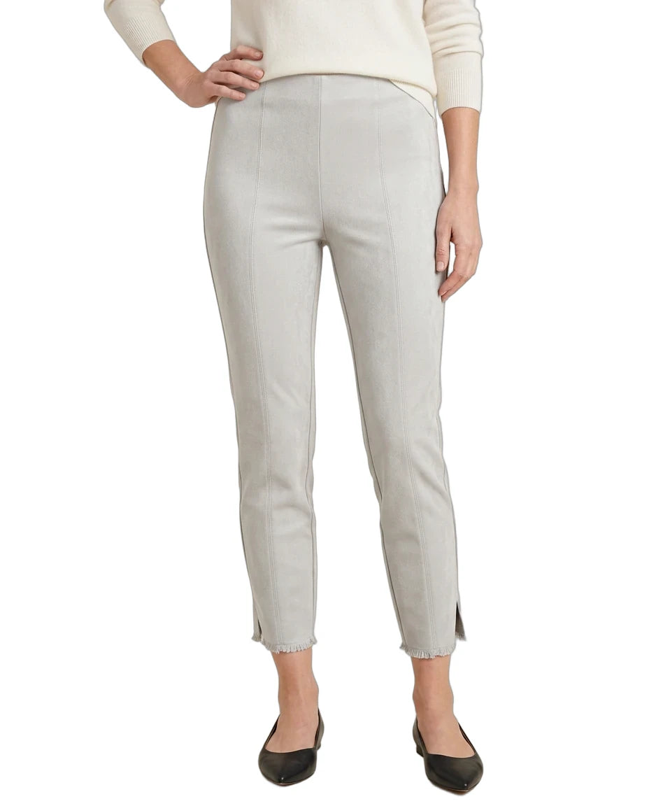 A model wearing light beige cropped trousers with side slits, paired with a cream long-sleeve top and black flats, shown against a plain white background.