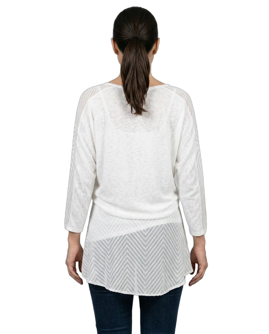 Woman wearing a white layered top on a white background