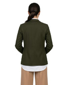 A woman shown from the back wearing an olive green blazer over a white shirt and tan pants, against a plain white background.