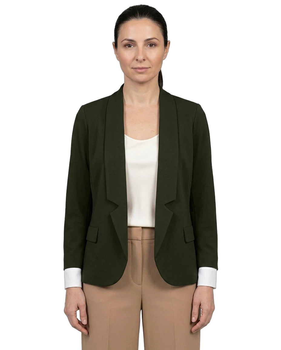 A woman modeling a dark olive green tailored blazer with shawl lapels, worn open over a cream top and tan trousers, against a plain white background.