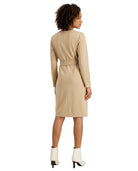 A woman shown from the back wearing a beige long-sleeve knee-length dress with a matching waist tie, paired with white ankle boots, against a plain white background.