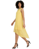 A woman modeling a sleeveless, high-low yellow dress against a plain white background.
