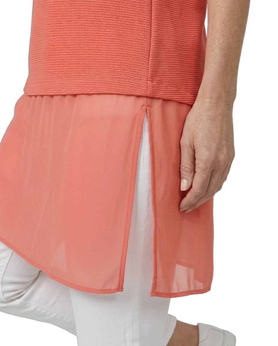 Coral layered dress with sheer overlay on a white background