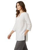 Woman wearing a white blouse with a V-neck and three-quarter sleeves on a white background