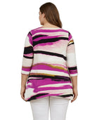 Woman wearing a colorful striped sweater on a white background