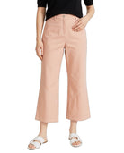 A model wearing a pair of light peach-colored cropped wide-leg pants, styled with a black top and white slide sandals, against a plain white background.