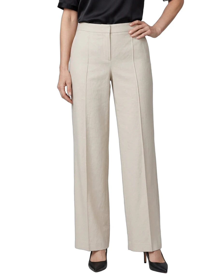 A model wearing a pair of high-waisted, wide-leg trousers in a light beige color, paired with a black top and black heels, shown against a plain white background.